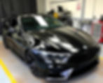 car wrapping service in gloss black at the factory.jpg