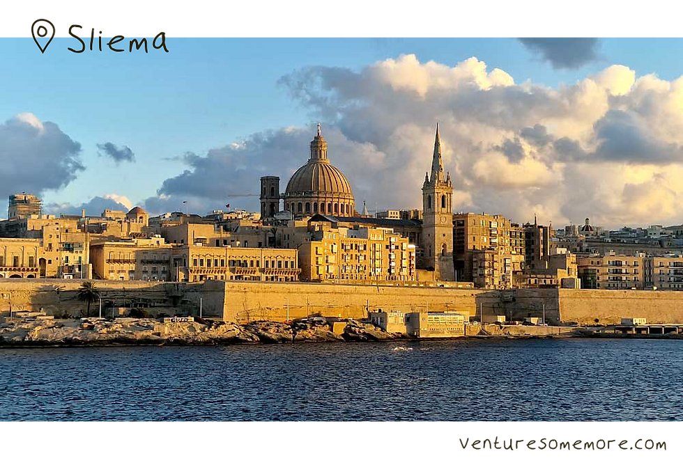 Sunset over the Valletta skyline in Malta across the harbour from Sliema