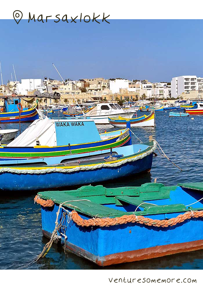 Colourful boats in Marsaxlokk fishing village harbour in Malta