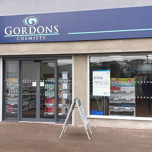 Pharmacy storefront with glass doors