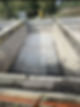concrete waste water treatment tank filled with liquid effluent