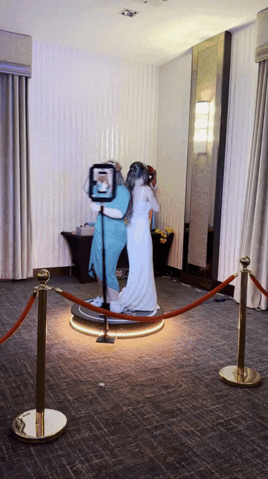 Professional 360 photo booth hire setup with red carpet and lighting for a VIP event.