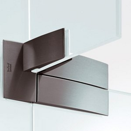 Sleek, modern chrome shower door hinge attached to clear glass