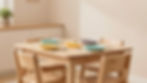 Children's table with colorful plates at Luz Family Daycare