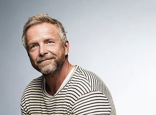 Smiling person wearing hearing aids