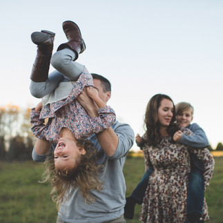 Playful family on the field