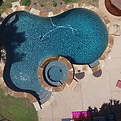 Swimming pool remodel with updated interior finish and tile