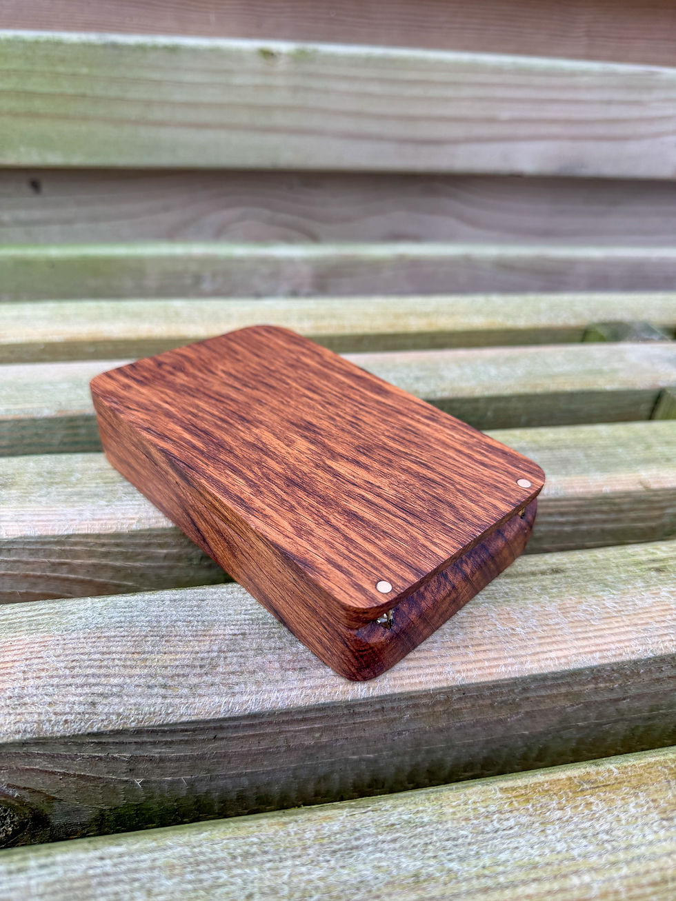 Thumbnail: beautiful oak walnut zebrano hardwood handmade fly fishing box case with a wooden back ground on a wooden bench uk made