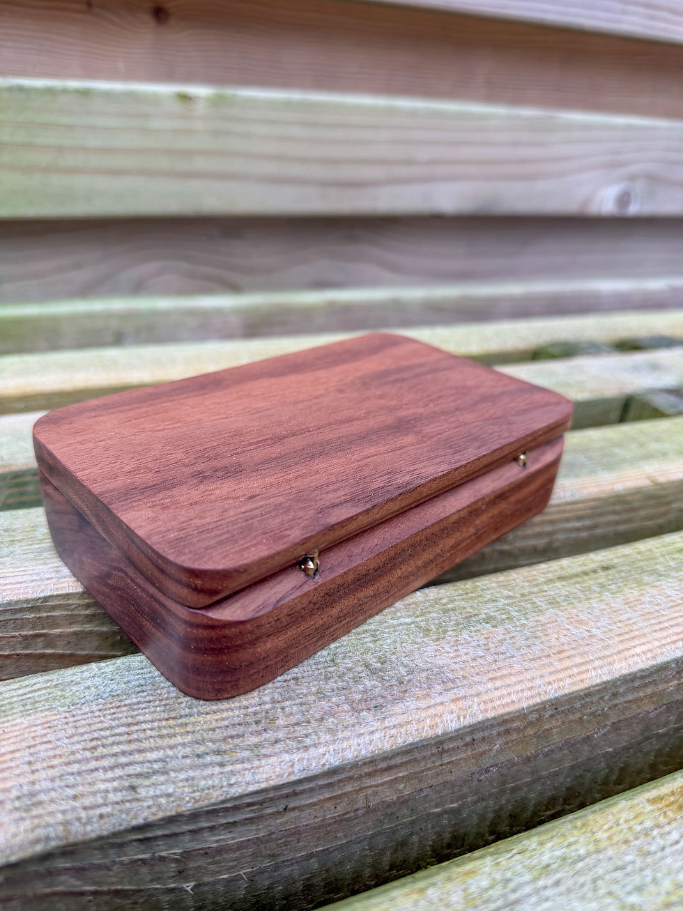 Thumbnail: beautiful oak walnut zebrano hardwood handmade fly fishing box case with a wooden back ground on a wooden bench uk made