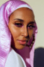 Muslim woman wearing a purple hijab