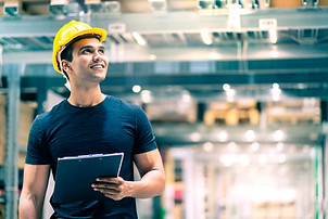 smart-indian-engineer-man-wearing-safety-helmet-doing-stock-tick-check-cardboard-stock-pro