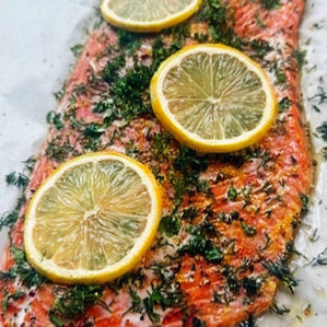 salmon with olive oil dill parsley lemon zest and lemon slices