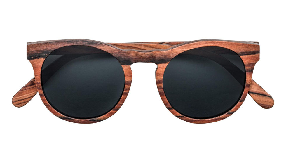 Round sunglasses with wood grain frames and dark lenses