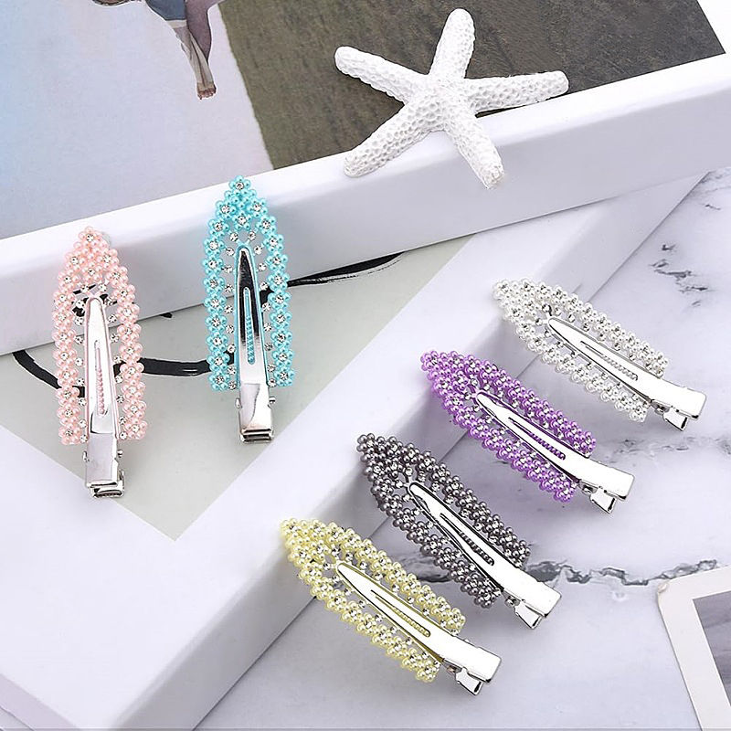 Six elegant pearl and rhinestone hair clips