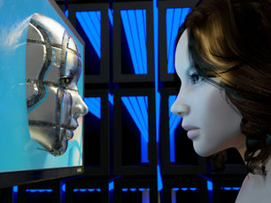 a female mannequin is looking at a computer screen A girl looks at a metal face on a computer