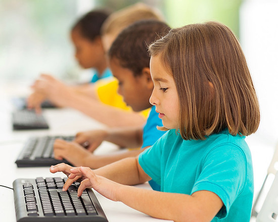 Group-of-elementary-students-typing-on-computers.jpg