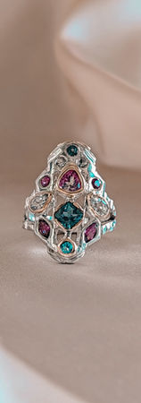 Handcrafted ring in 935 silver and 12k gold featuring blue topazes and rhodolite garnets in a stained-glass inspired mosaic composition by VAN-LUI Jewellery.