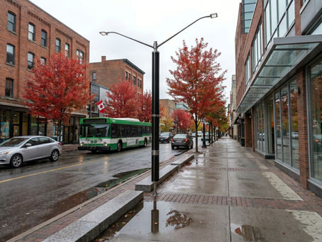 Stern Power Pole with vertical solar panels providing sustainable street lighting on urban sidewalk in Canadian city