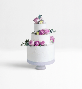 Best Wedding Photographers in Dubai - layered wedding cake with floral decorations