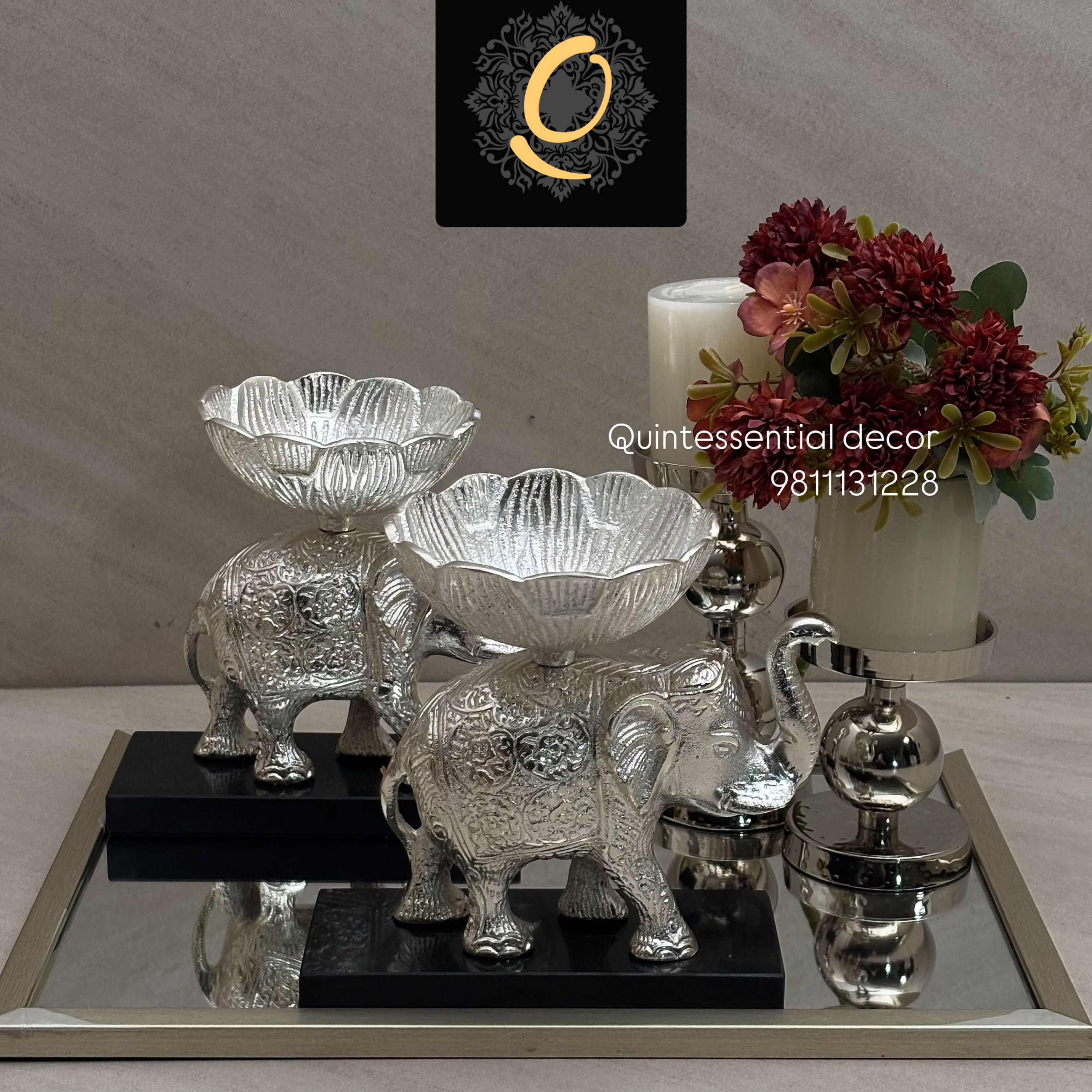 Elephants adorned with lights