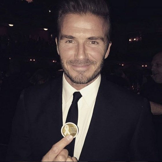 David Beckham holding a White Ribbon campaign token