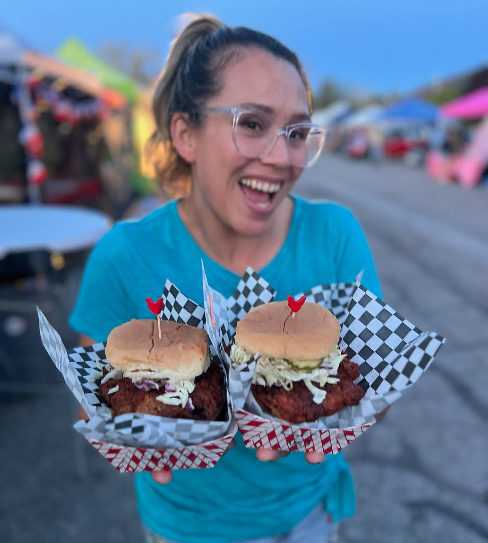 Gmailing girl with enormous sandwiches at Taste of the Peaks