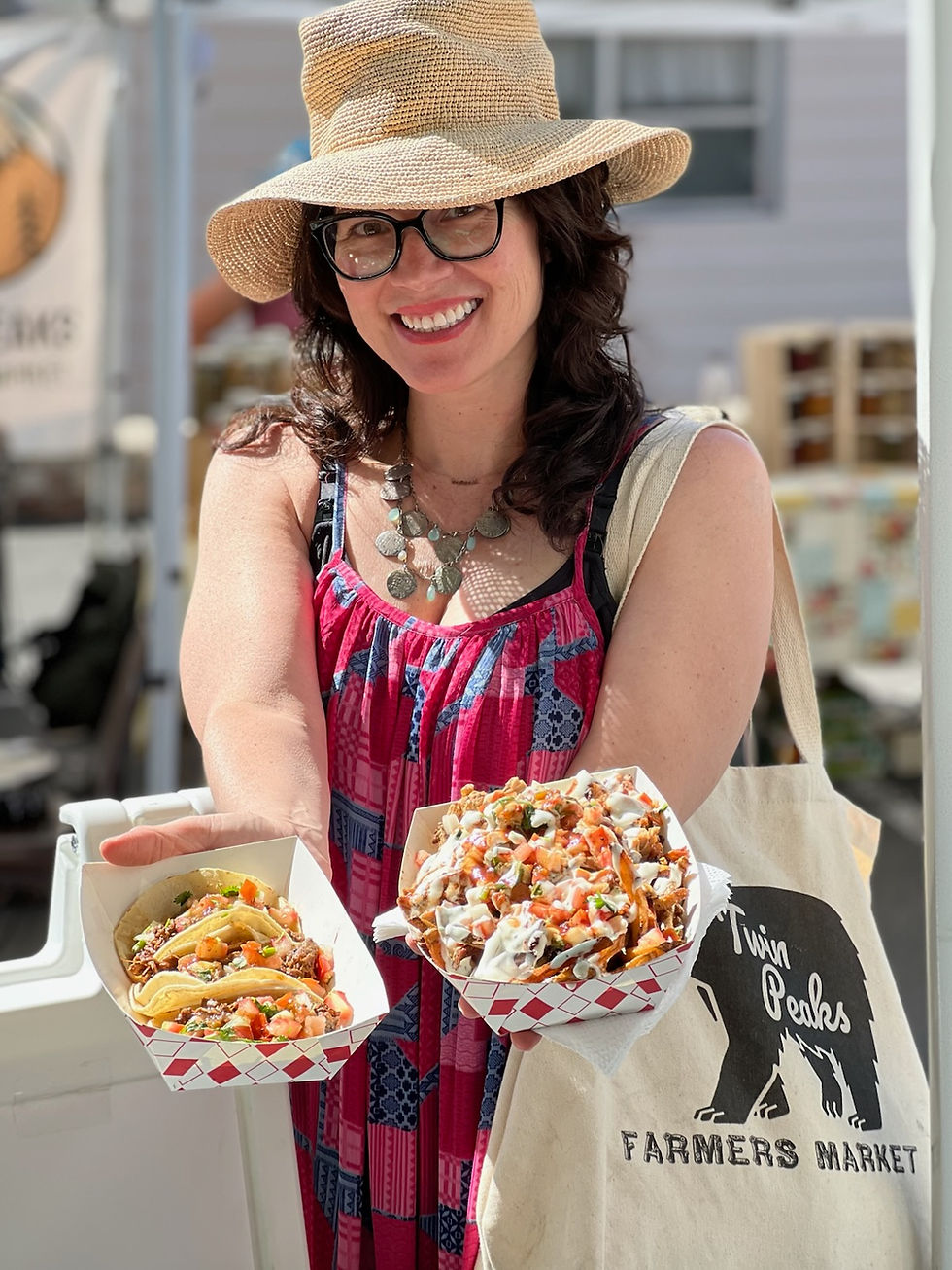 Lovely woman handing out Mexican Food at Taste of the Peaks.
