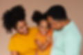 front-view-black-family-posing-studio.jpg