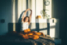 woman-waking-up-in-the-morning-and-stretching-in-b-2024-10-15-08-25-11-utc.jpg