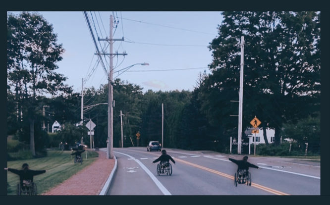 [image description]: yannick-robin rolls down a long winding road. there are duplicates of him in different places on the road and surrounding pavement. he is enjoying his way down, with arms up like wings.