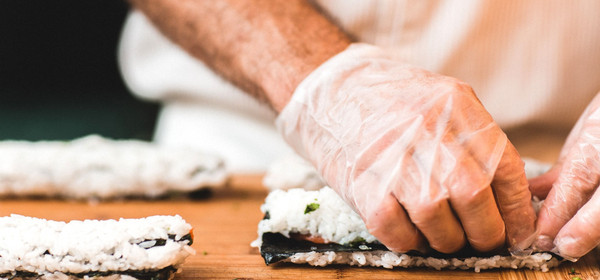 Chef handcrafting fresh sushi at Raw Sushi Bistro
