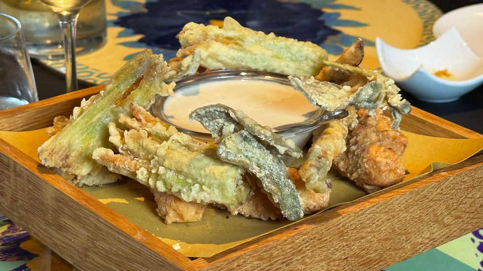 Delicious fried zucchini blossoms, bread and sage served with a cheese & anchovy sauce