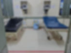 Two hospital beds side by side in a hospital room