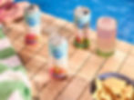 Now Coco Cans sitting next to a swimming pool in the sun