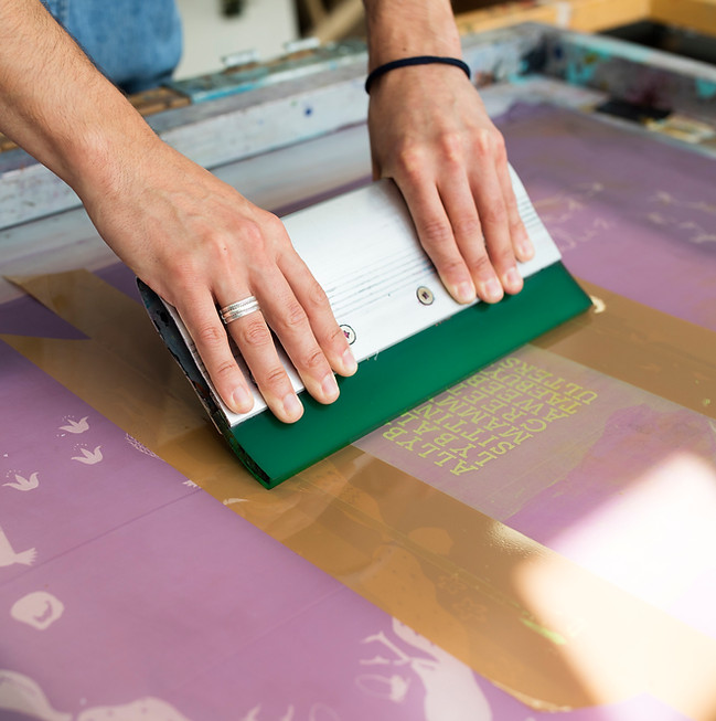 hands-of-young-male-printer-using-squeegee-in-prin-2025-04-03-03-56-44-utc.jpg