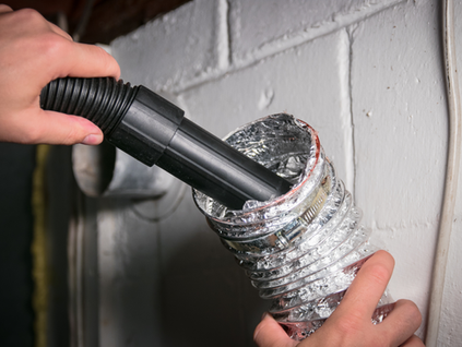 Professional dryer vent cleaning service removing lint buildup for better airflow and home safety.