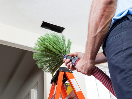 Professional Air Duct Cleaning Palm Desert CA technician removing dust from vents