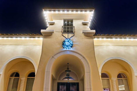 Elegant Christmas light display highlighting the roofline and landscape of a Sacramento home.