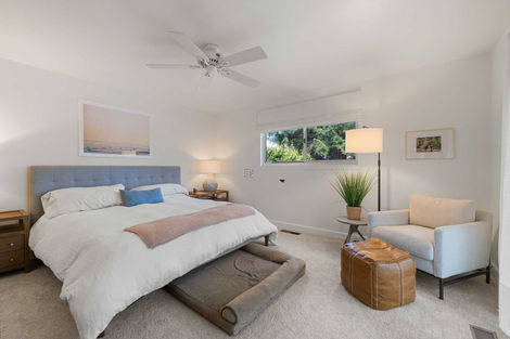 Bedroom with modern finishes and updated windows in the Fair Oaks remodel.