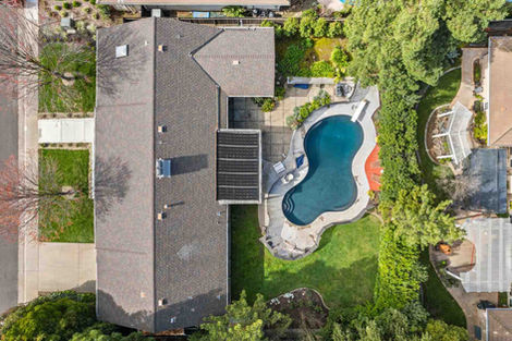 Wider aerial showing the full property in the Fair Oaks home.
