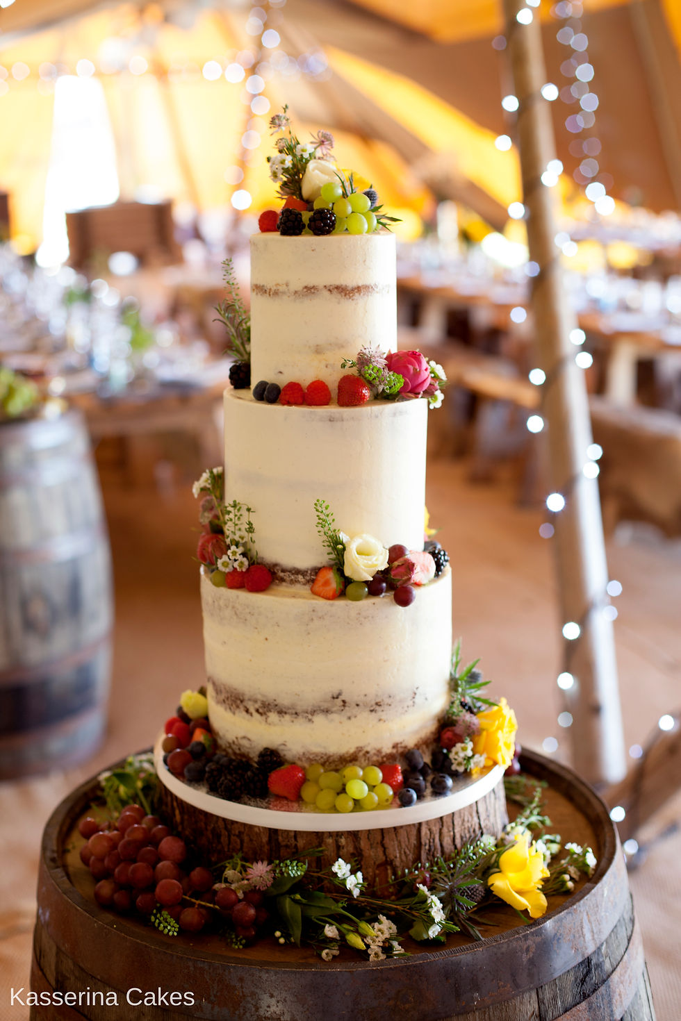 semi-naked wedding cake marquee wedding seminaked naked tiered cake sussex bride tent tipi festival