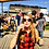 Woman in plaid shirt with sunglasses drinking outdoors