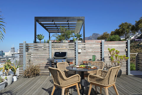 Rooftop deck with outdoor dining and BBQ grill
