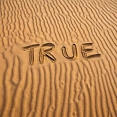 word true written on sand
