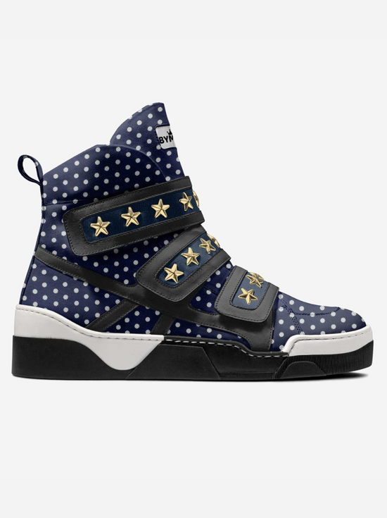 Navy high-top sneaker with white polka dots and gold star straps.