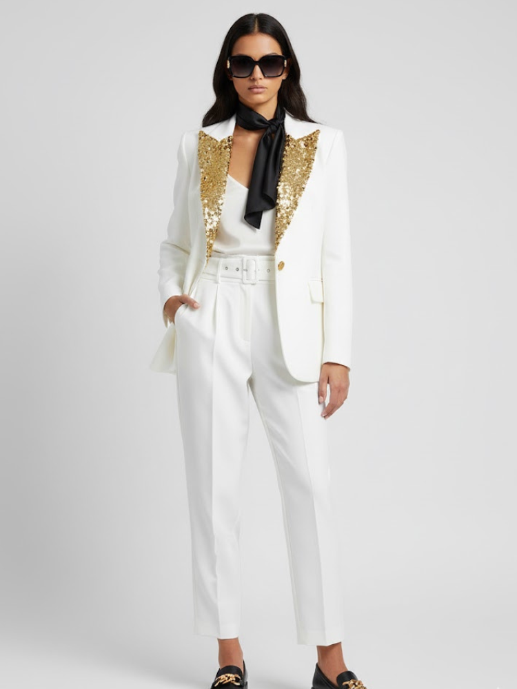 Thumbnail: Stylish woman wears white suit, sequined gold lapels, elegant black scarf.