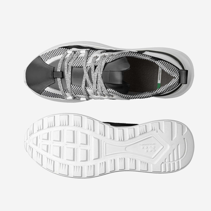 Top and bottom view of a grey and white athletic sneaker.