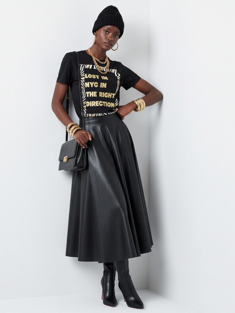 Woman in black t-shirt, LOVE IN NYC, and black midi skirt.