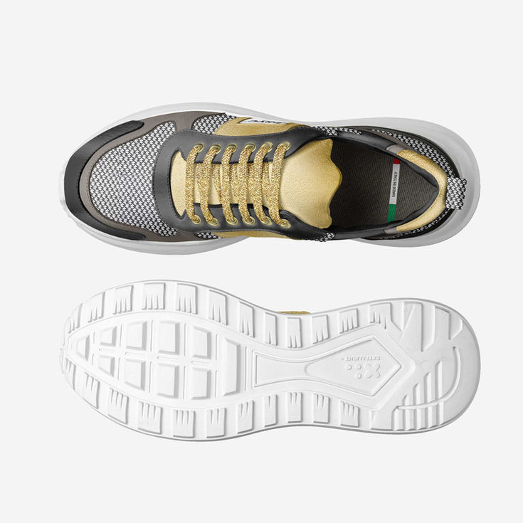 Top and sole view of grey and gold athletic sneaker UNITED