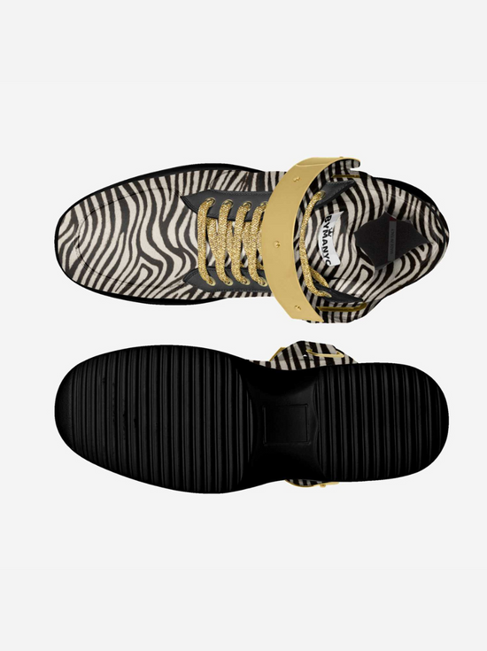 Zebra print high-top shoes with golden laces and black ridged sole.